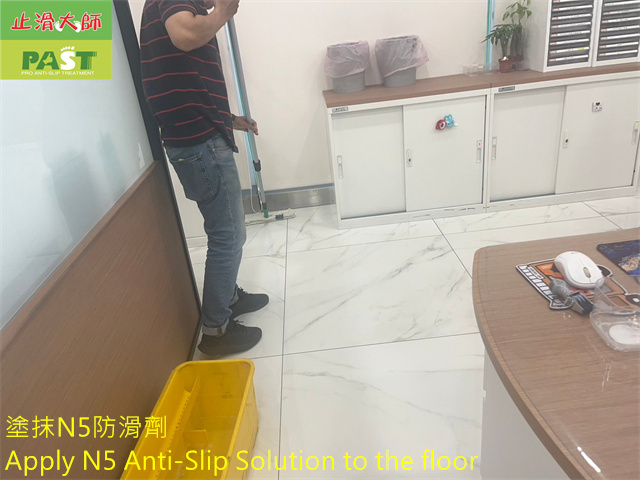 anti-slip construction on polished marble imitation tile floor
